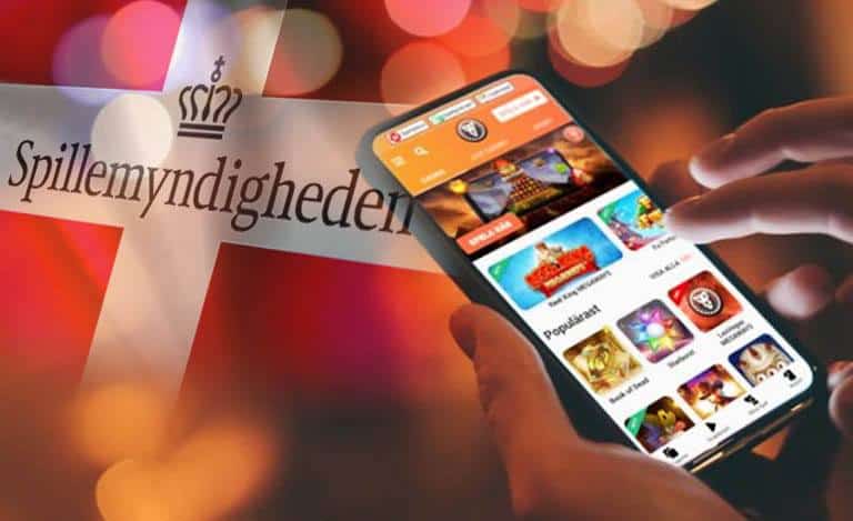 Jeux de casino en ligne sur le téléphone mobile devant le drapeau danois